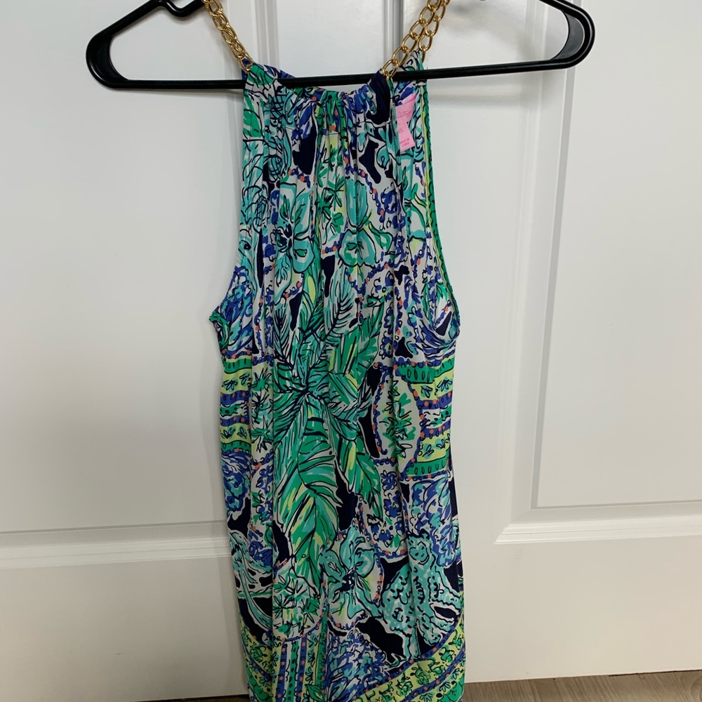 Lilly Pulitzer silk top with gold chain detail.